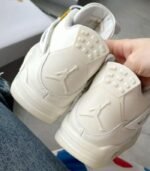 jordan_4_retro_metallic_gold_w_1711075525_6d8a154d_progressive-1.jpg
